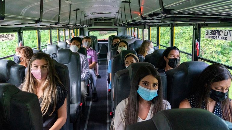 Teachers take a school bus tour of the Jericho school...