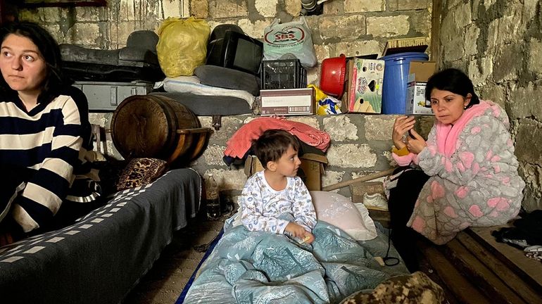 Children are in a shelter during shelling in Stepanakert in...