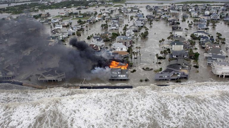 Fire destroys homes along the beach on Galveston Island, Texas...