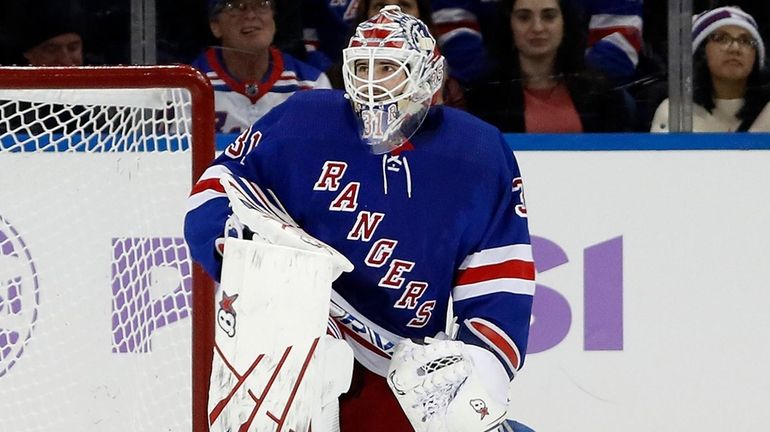 Igor Shesterkin #31 of the Rangers looks on after surrendering...