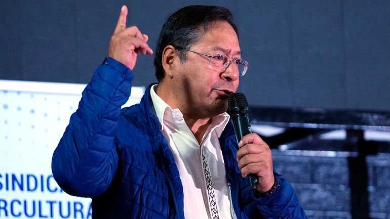 Bolivian President Luis Arce addresses an assembly of farm workers...