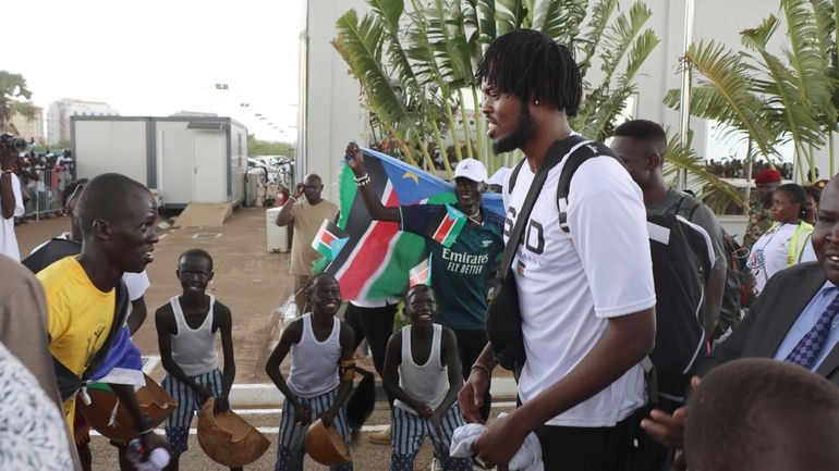 South Sudan basketball player Koch Bar, is welcomed back at...