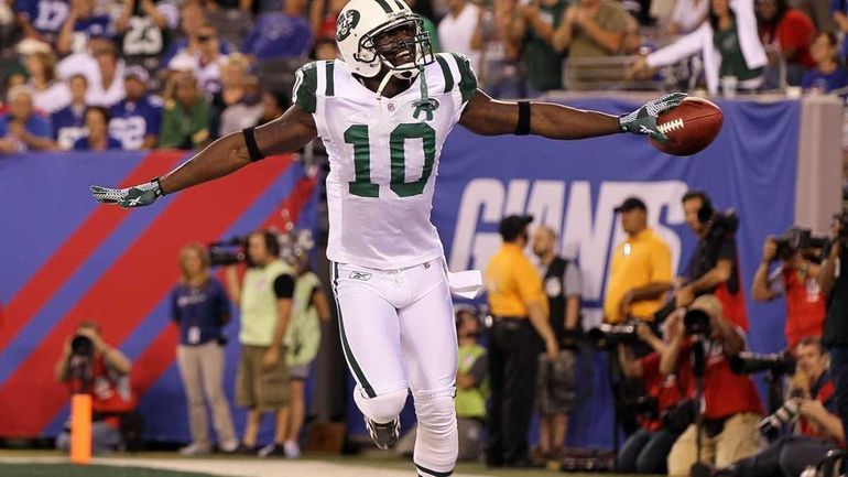 Santonio Holmes of the New York Jets celebrates his second...