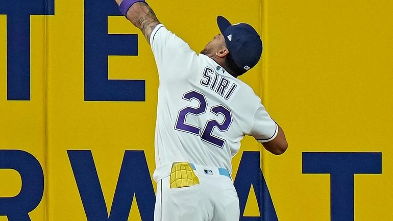 Tampa Bay Rays center fielder Jose Siri (22) makes a...