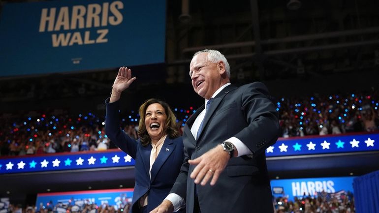 Vice President Kamala Harris and her running mate, Minnesota Gov....