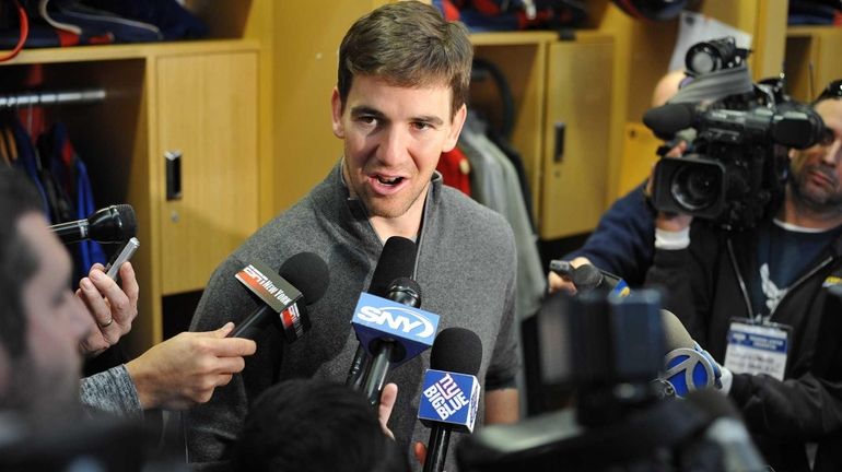 New York Giants quarterback Eli Manning speaks to the media...