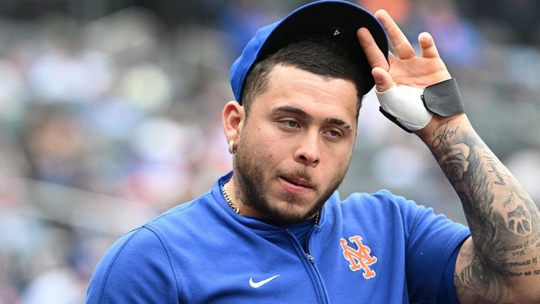 Mets catcher Francisco Alvarez looks on from the dugout during...