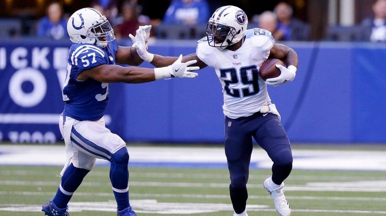 The Titans' DeMarco Murray runs against the Colts' Jon Bostic...