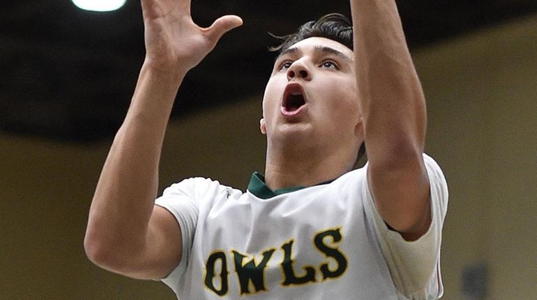 Rylan Blondo of Lynbrook hits a layup after making a...