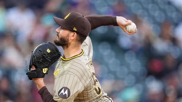 San Diego Padres starting pitcher Dylan Cease works against the...