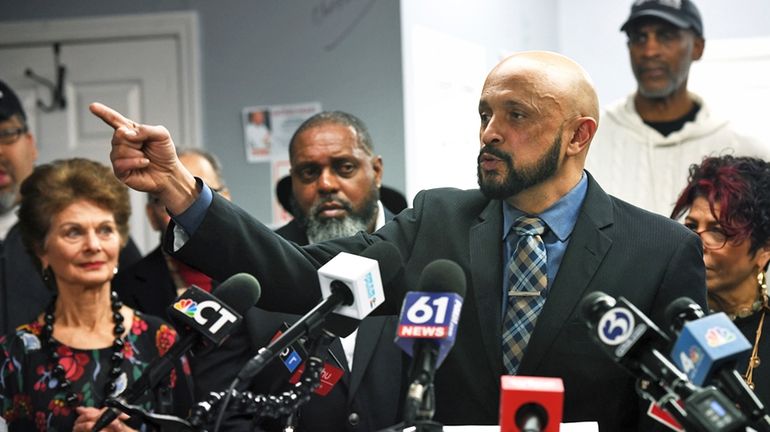 John Gomes speaks during a news conference at his campaign...