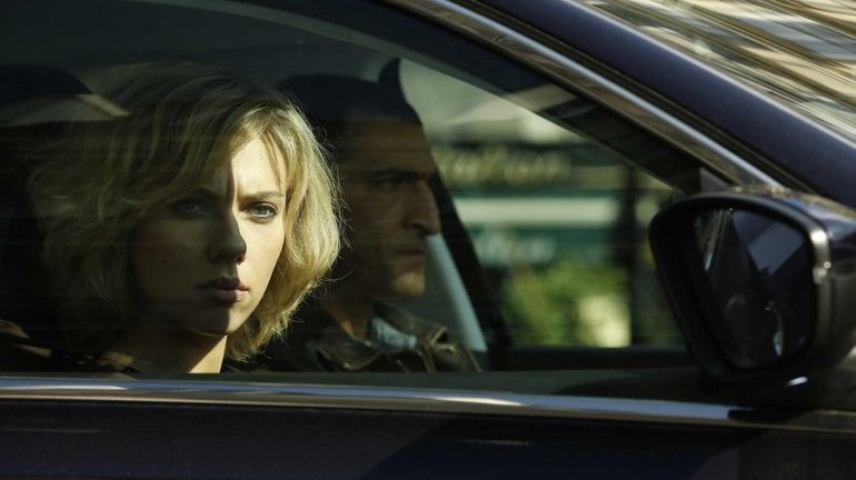 Scarlett Johansson in the action thriller "Lucy," written and directed...