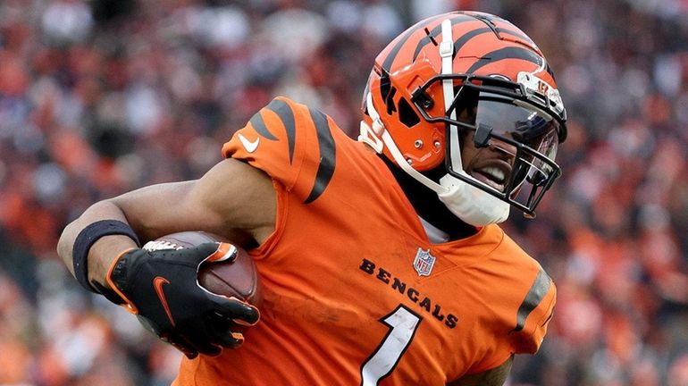 Ja'Marr Chase of the Bengals carries the ball against Kansas City...