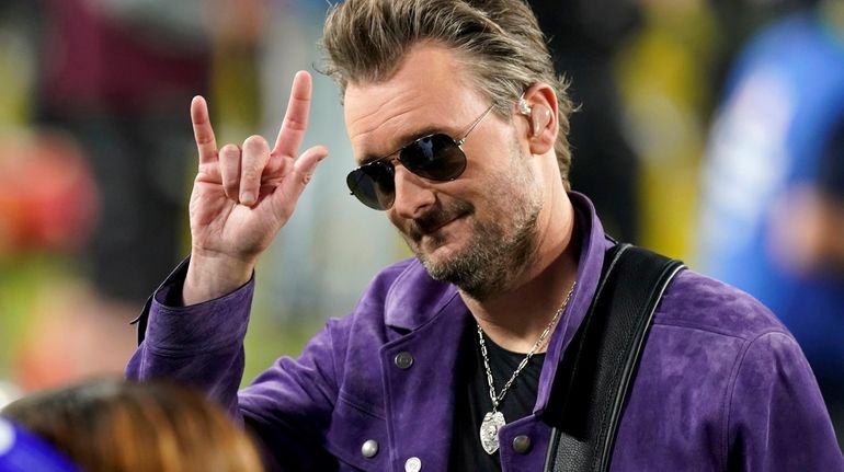 Eric Church performs the national anthem before the start of...