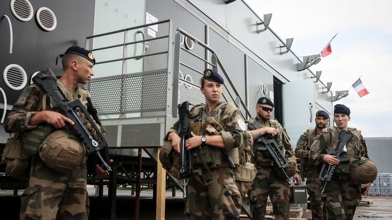 Soldiers leave for a patrol at the military camp set...