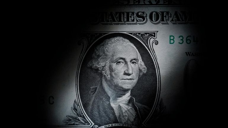 The likeness of George Washington is seen on a U.S....