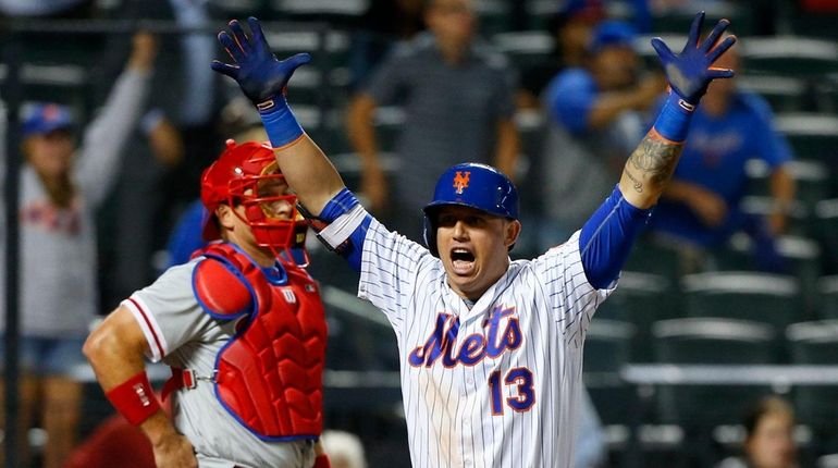 Asdrubal Cabrera #13 of the New York Mets celebrates his...