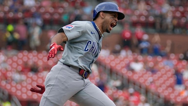 Chicago Cubs' Christopher Morel rounds the bases after hitting a...