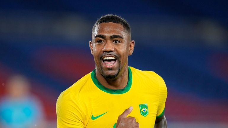 Brazil's Malcom celebrates scoring his side's second goal against Spain...