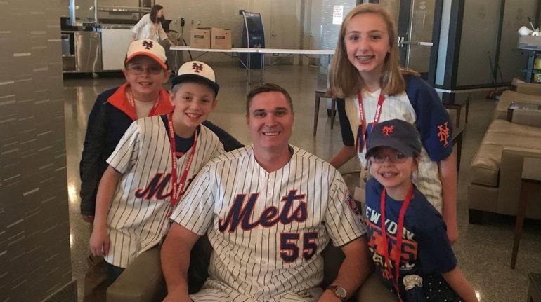 New York Mets pitcher Corey Oswalt at Citi Field with Kidsday...