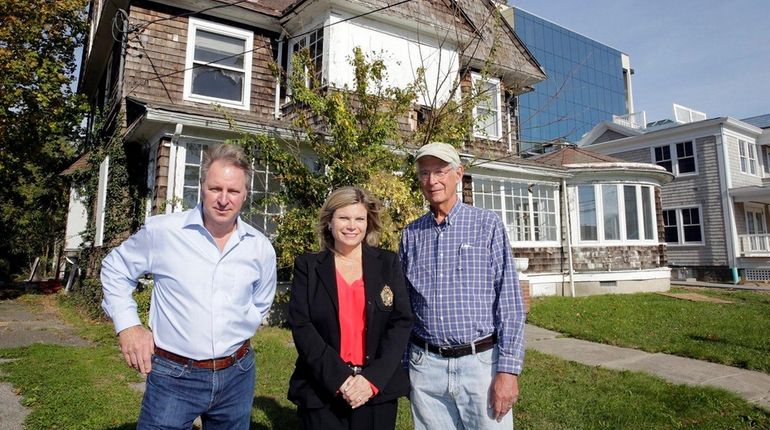 Property owner Joseph Petrocelli, left, Riverhead Town Councilwoman Jodi Giglio,...