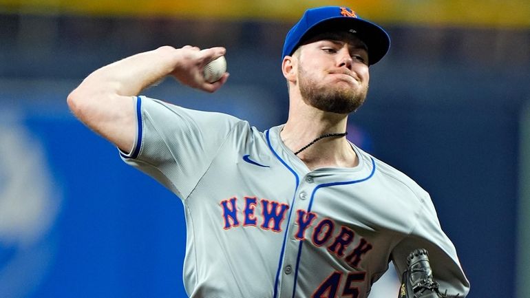 Mets' Christian Scott pitches to the Tampa Bay Rays during...