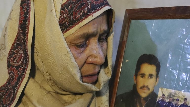 The mother of Mohammed Hassan, a Pakistani porter who died...