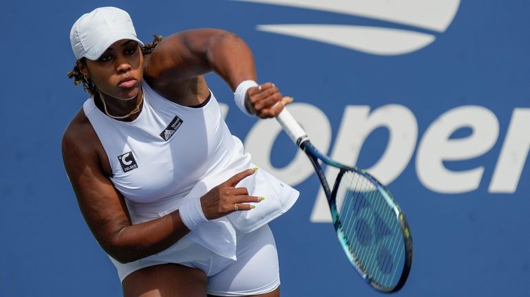 Taylor Townsend serves to Beatriz Haddad Maia during the second round...