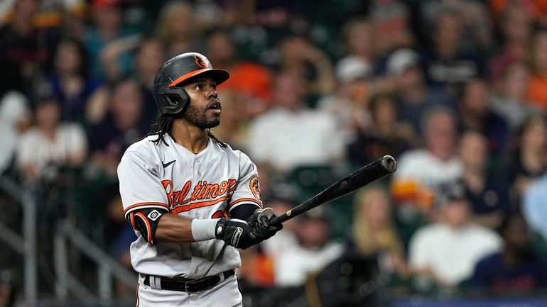 Baltimore Orioles' Cedric Mullins watches his three-run home run against...