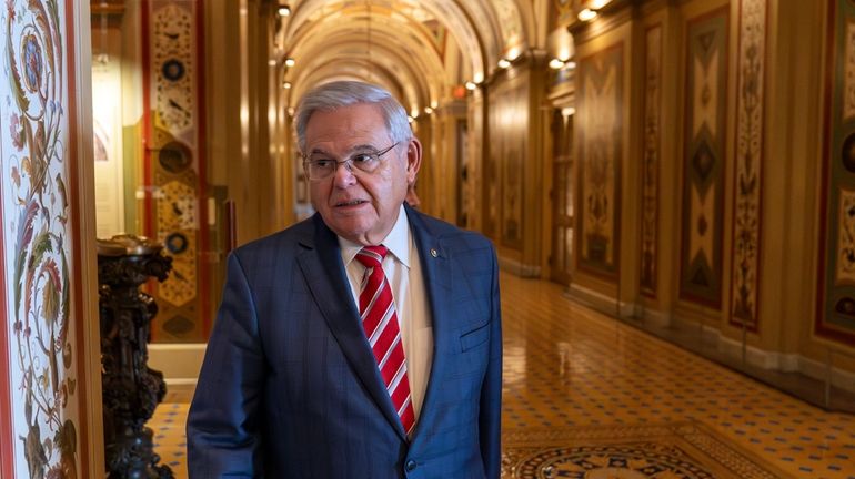 Sen. Bob Menendez, D-N.J., departs the Senate floor in the...