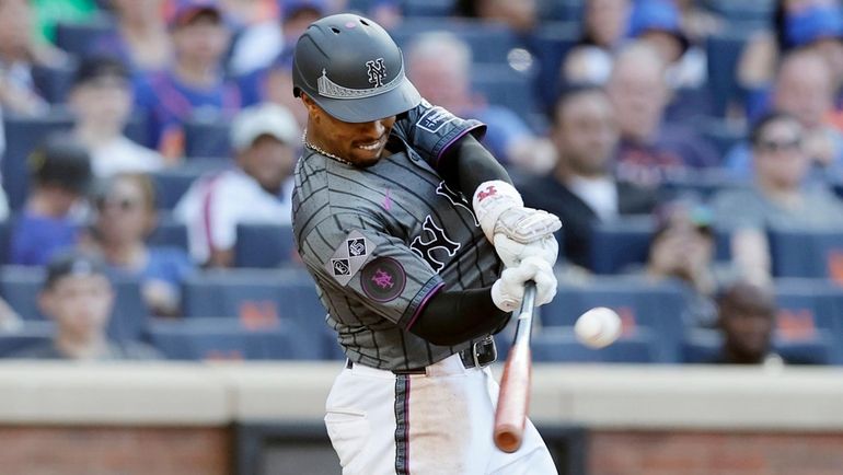 Francisco Lindor of the Mets connects on his eighth-inning three-run home...