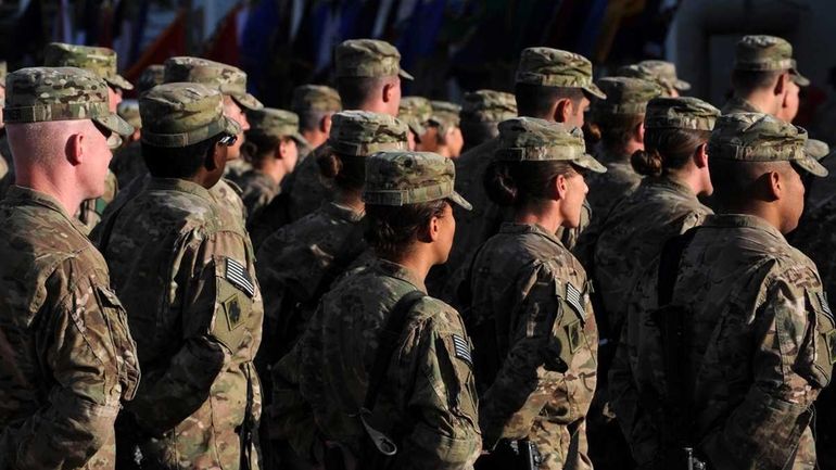 U.S. soldiers attend a memorial ceremony at the Bagram Airfield,...