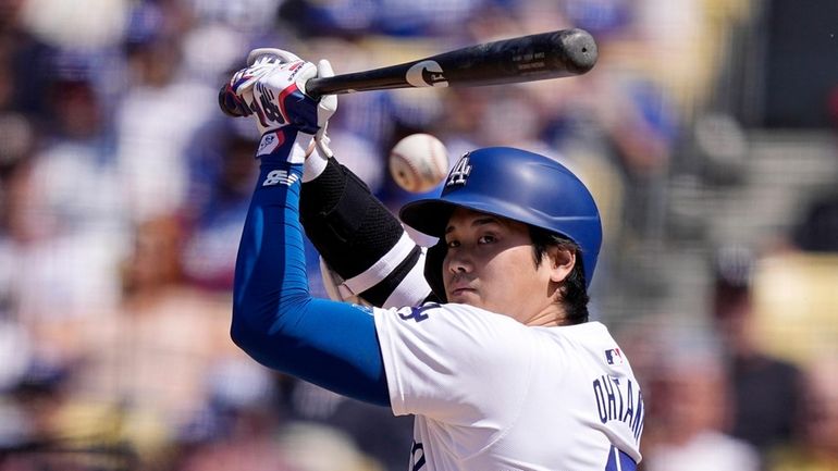 Los Angeles Dodgers' Shohei Ohtani hits a foul ball during...