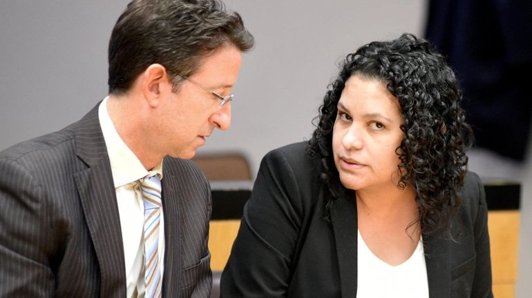 Donatila O'Mahony listens to her lawyer, Ira Weissman, during jury deliberations Monday...