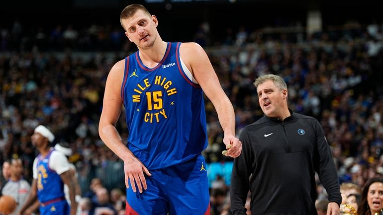 Denver Nuggets center Nikola Jokic (15) walks away from Minnesota...