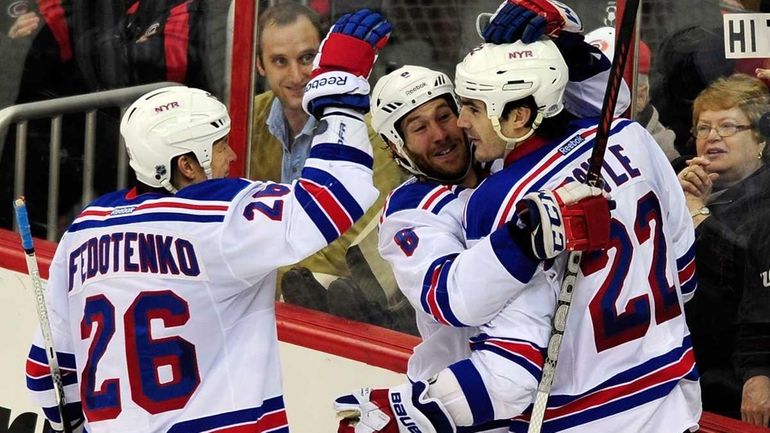 Rangers' Ruslan Fedotenko (26), Brandon Prust (8) and Brian Boyle...