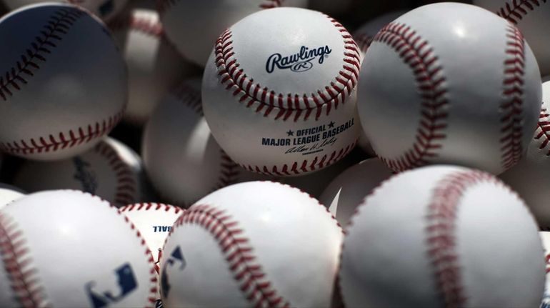 A basket of batting practice balls waits near the batting...