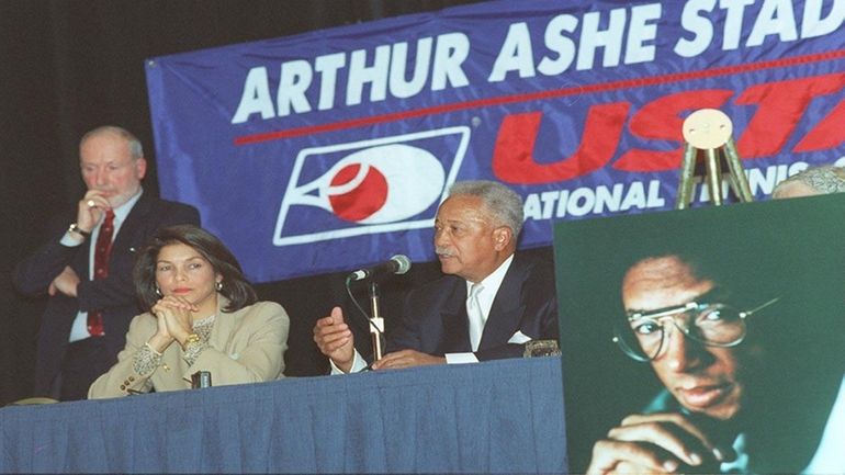 USTA President Harry Marmion, standing, and Jeanne Moutoussamy-Ashe join former...