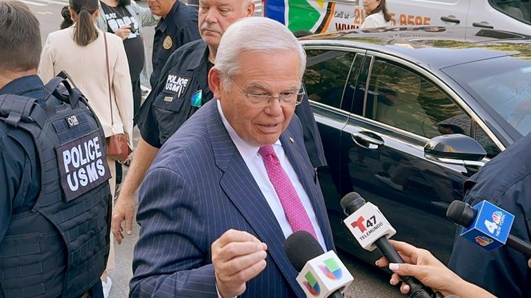 U.S. Sen. Bob Menendez, D-N.J., leaves federal court following the...