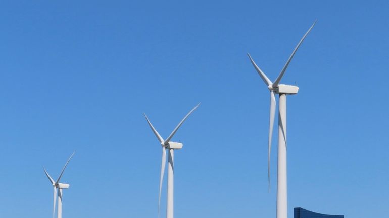 Land-based wind turbines spin in Atlantic City, N.J., on April...