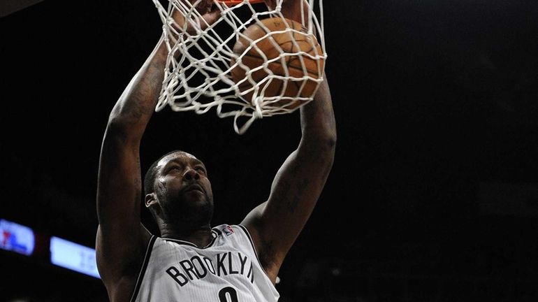 Brooklyn Nets forward/center Andray Blatche dunks against the Philadelphia 76ers...