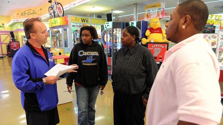 Adventureland manager Paul Gentile talking with applicants who are seeking...