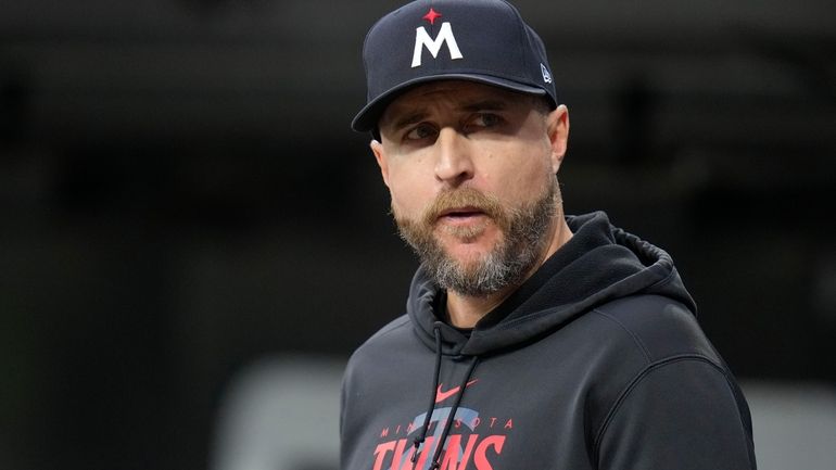 Minnesota Twins manager Rocco Baldelli watches from the dugout during...