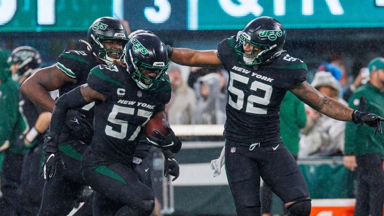 Jets defensive end Jermaine Johnson (52) celebrates an interception by...