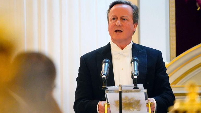 Britain's Foreign Secretary Lord David Cameron speaks at the Lord...