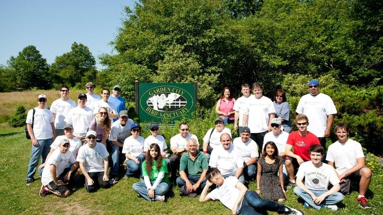 Volunteers from Liberty Mutual Insurance and Garden City High School...