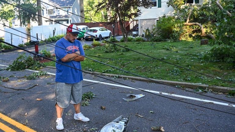 Scott Casagrande, in front of his home on West Hills...