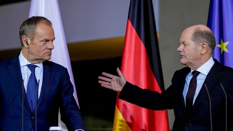 German Chancellor Olaf Scholz, right, and Poland's Prime Minister Donald...