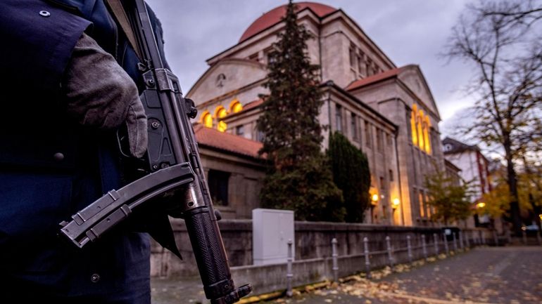 FILE -A German police officer stands guard in front of...