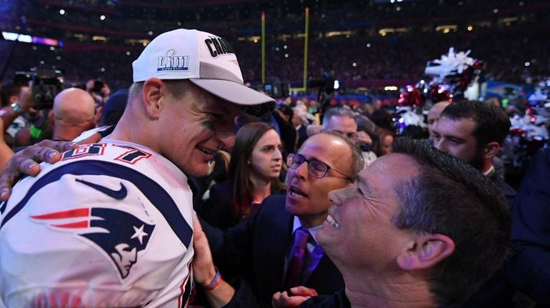 Patriots tight end Rob Gronkowski celebrates after his team won...